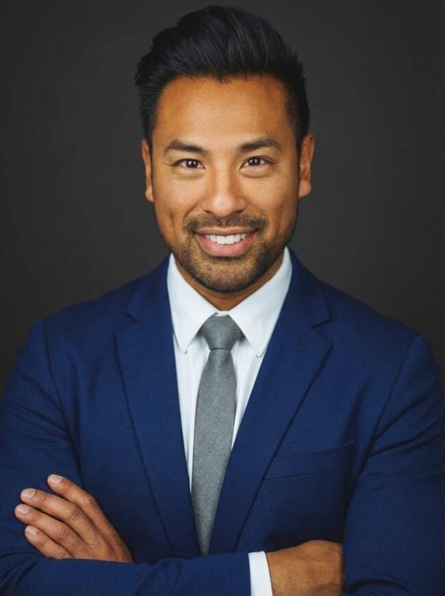 Portrait of a confident businessman in suit, professional headshot for corporate branding.